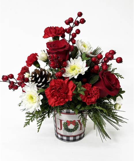 red holiday floral arrangement in Joy container